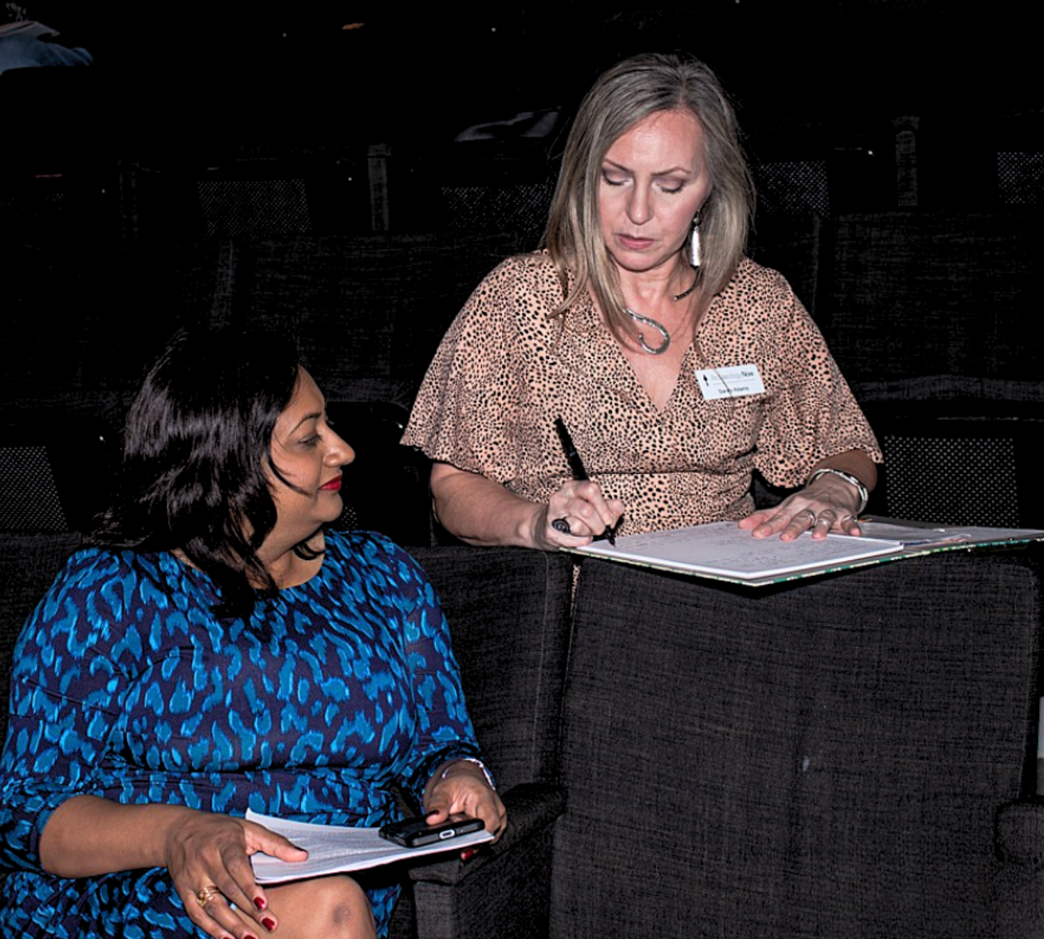 Sandy Adams working with historian Dr. Sushma Jansari during an Archaeology Now event in Houston