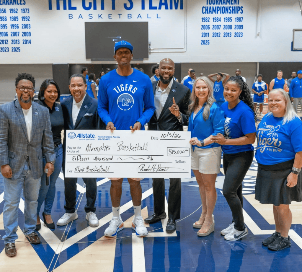 Sandy Adams, Vice President of The Memphis Rebounders, and the board presenting a check to Memphis Tigers head coach Penny Hardaway at Happy Hour Hoops