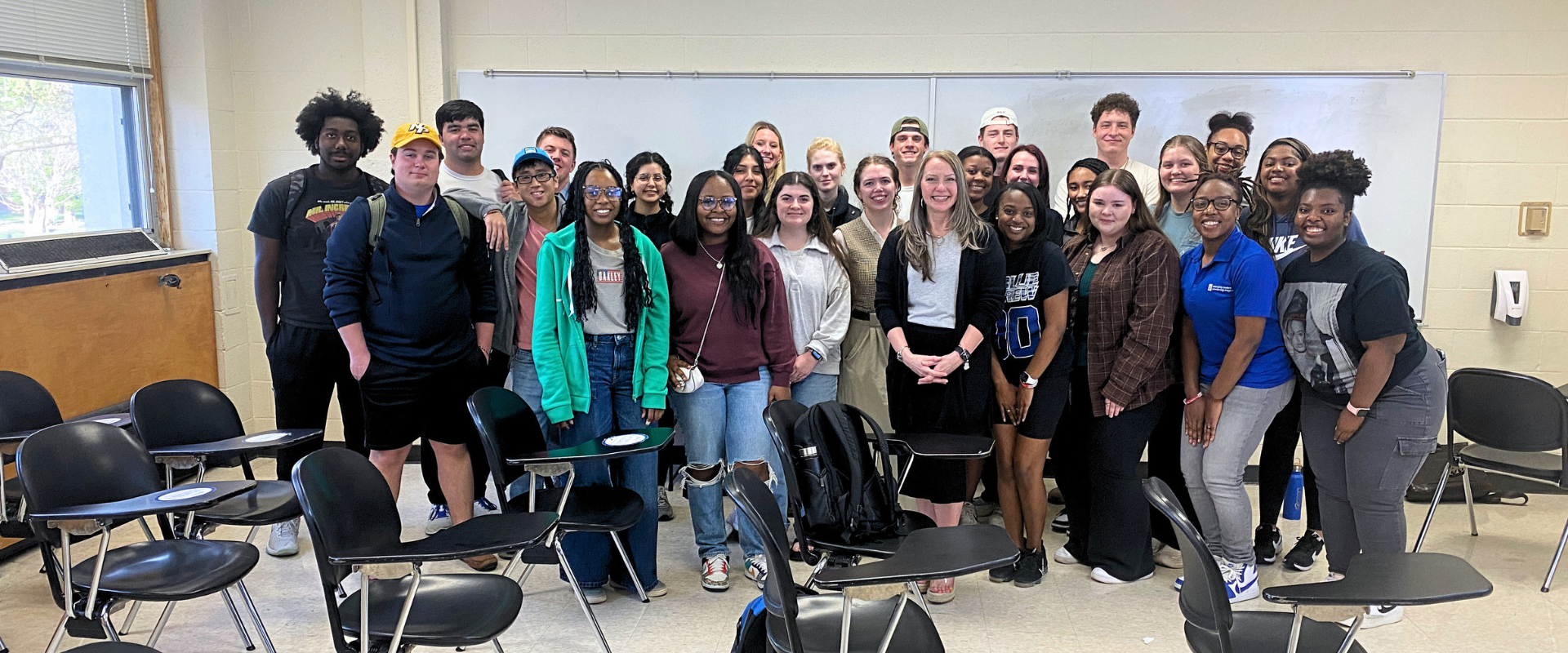 Sandy Adams with University of Memphis Emerging Leaders Scholarship Program students following a leadership workshop.